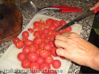 cutting peeled tomatoes